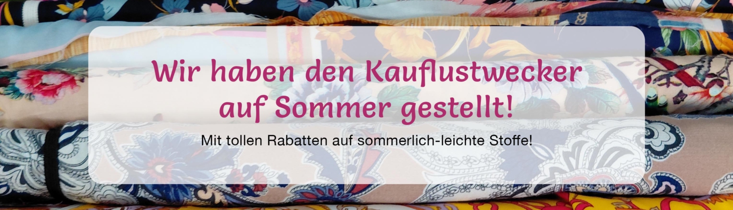 Kauflustwecker zur Sommeraktion 2026 Verschiedene Sommerstoffe in Cilly's Nähkästchen – Dem Stoffgeschäft in Senden. Darauf steht: "Wir haben den Kauflustwecker auf Sommer gestellt!"